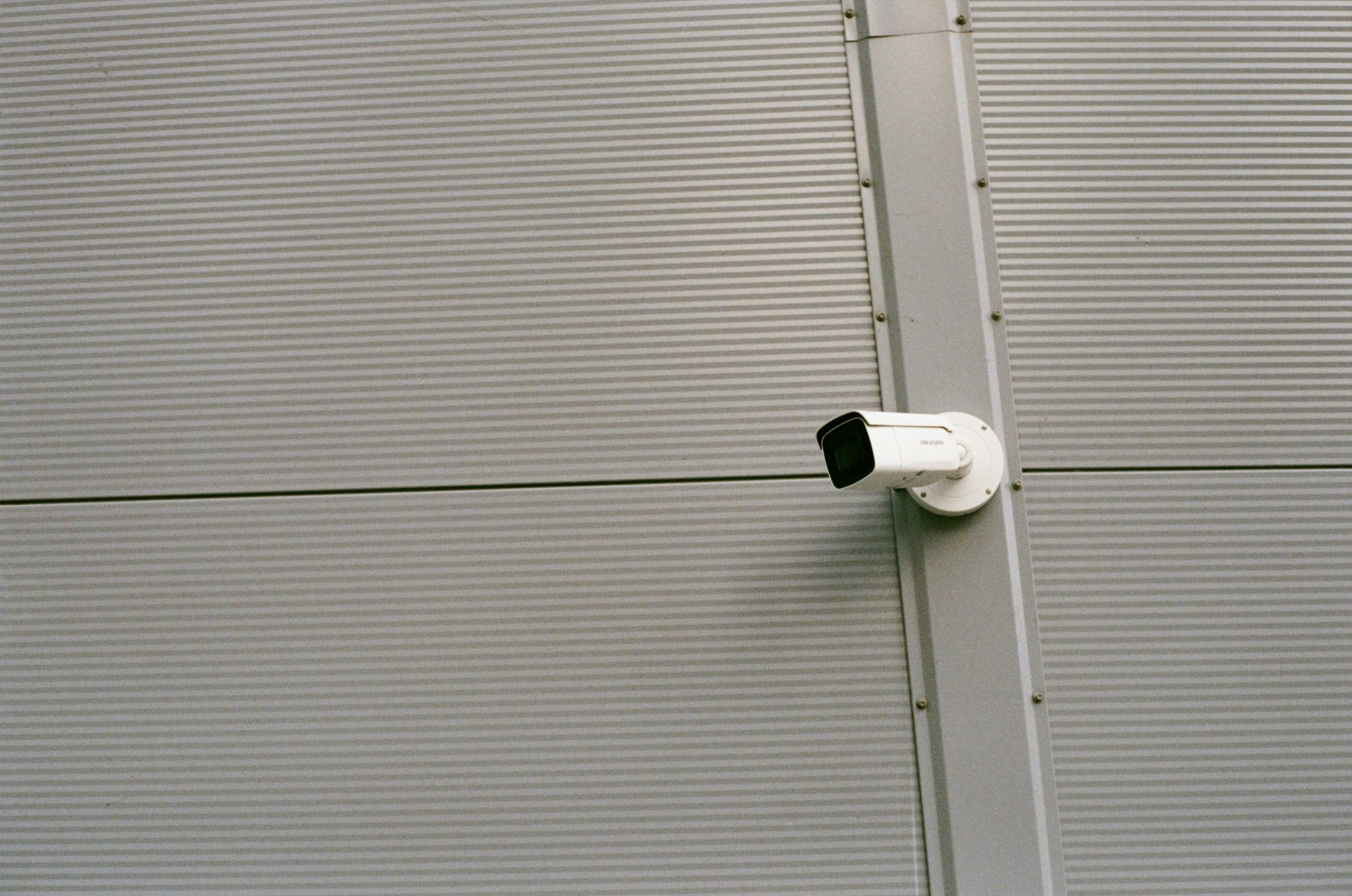 IP surveillance camera on side of building